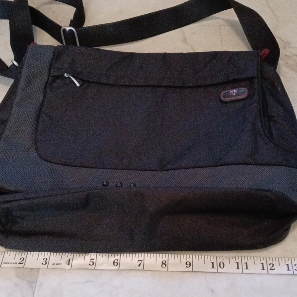 Tumi Black Laptop Messenger Bag.